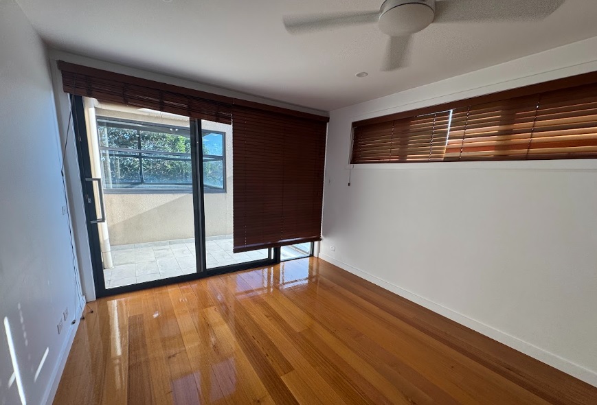 Empty rental living room with polished floors ready for final bond inspection on the Gold Coast
