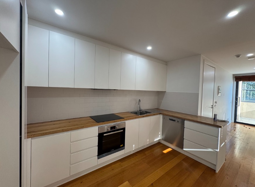 Clean kitchen with built-in oven ready for bond inspection in Gold Coast rental property